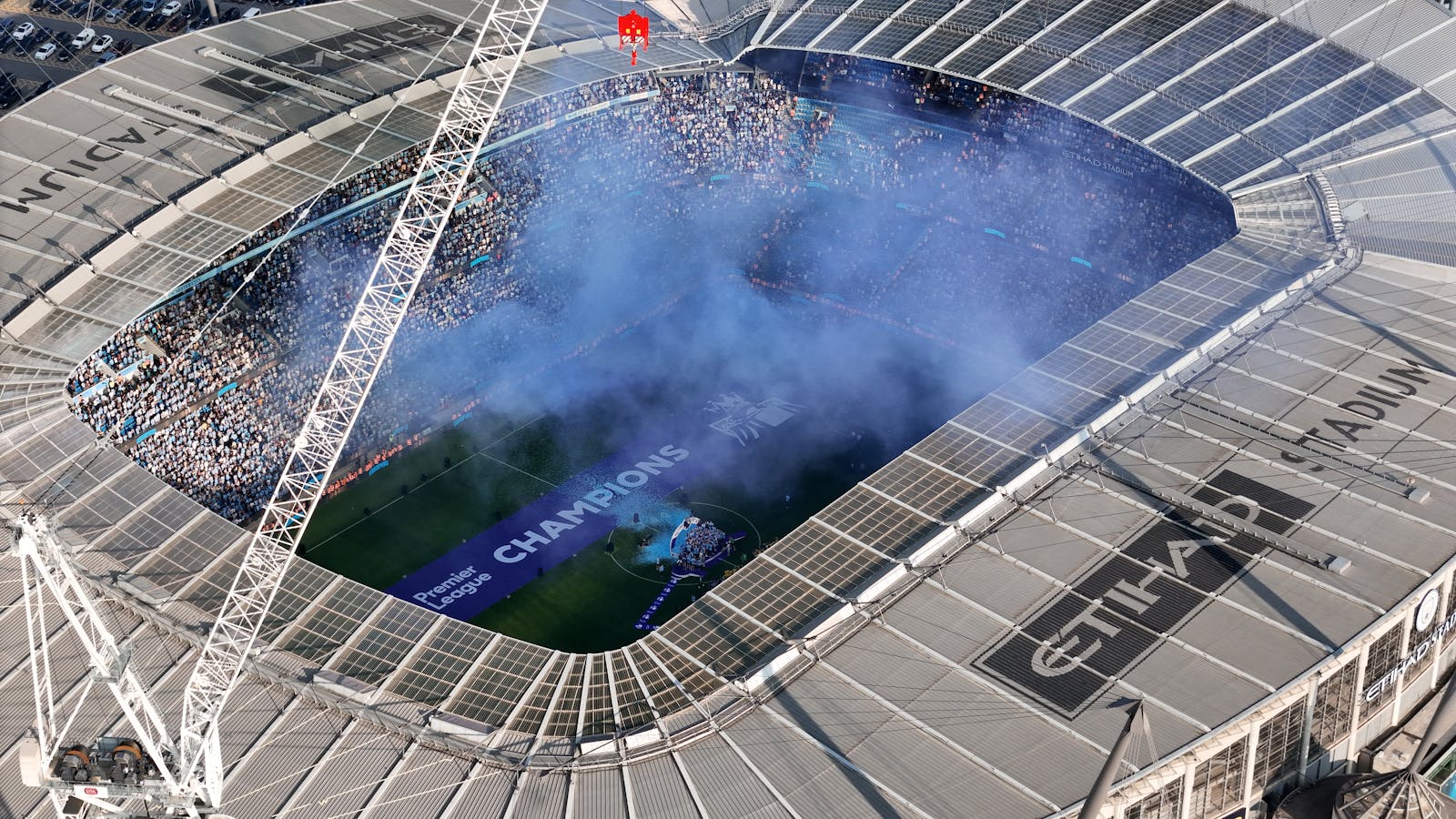 Aerial shot of Etihad Stadium during a soccer event in Manchester, UK.